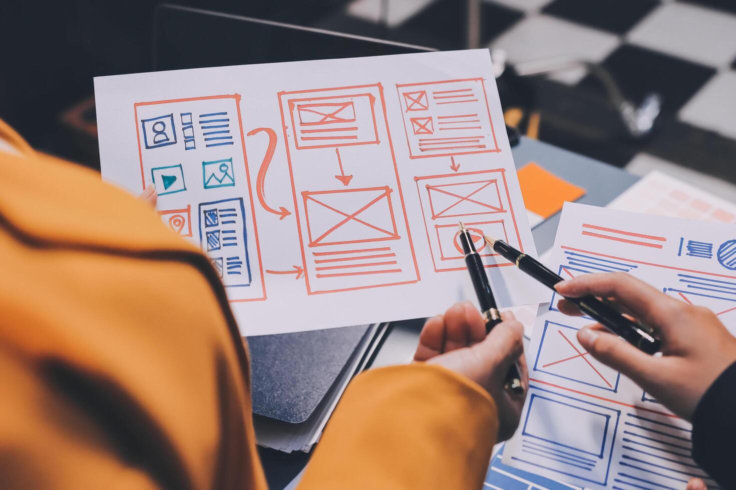 The designer team is designing the uxui system to make the uxui system work well on new phones and support system updates. Website development concept UI UX front end designer photo
