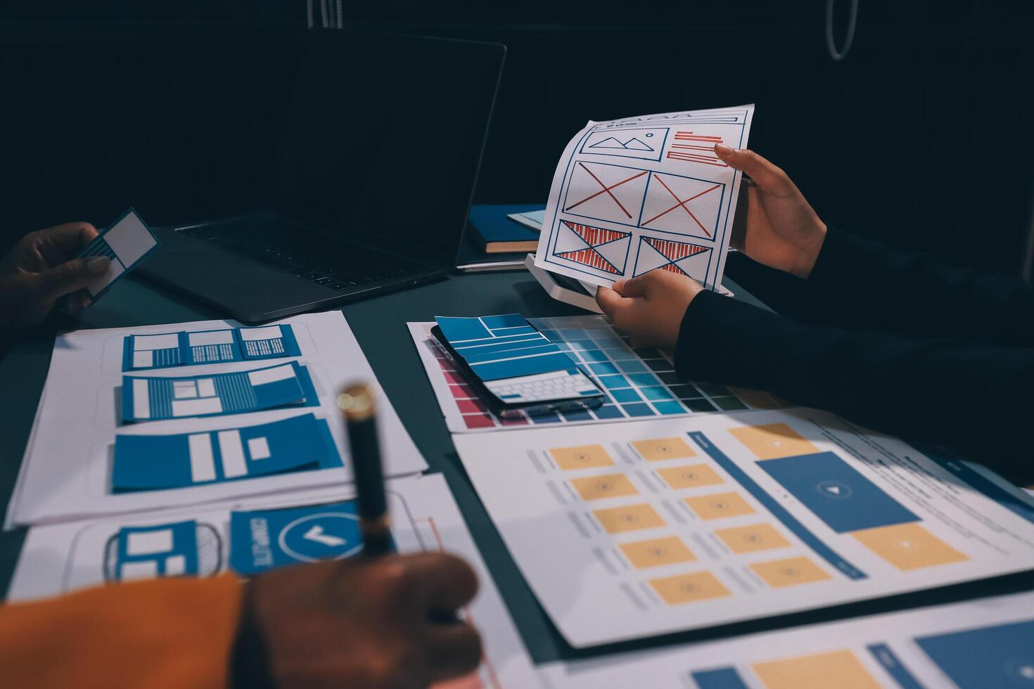The designer team is designing the uxui system to make the uxui system work well on new phones and support system updates. Website development concept UI UX front end designer photo