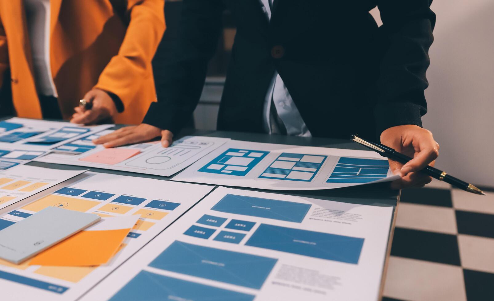 The designer team is designing the uxui system to make the uxui system work well on new phones and support system updates. Website development concept UI UX front end designer photo