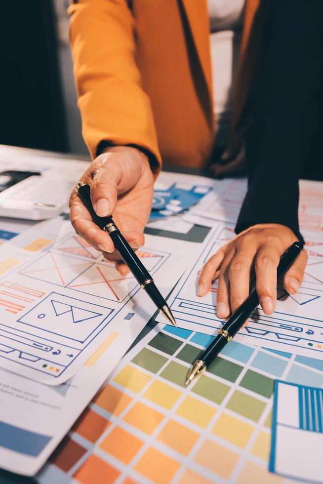 The designer team is designing the uxui system to make the uxui system work well on new phones and support system updates. Website development concept UI UX front end designer photo