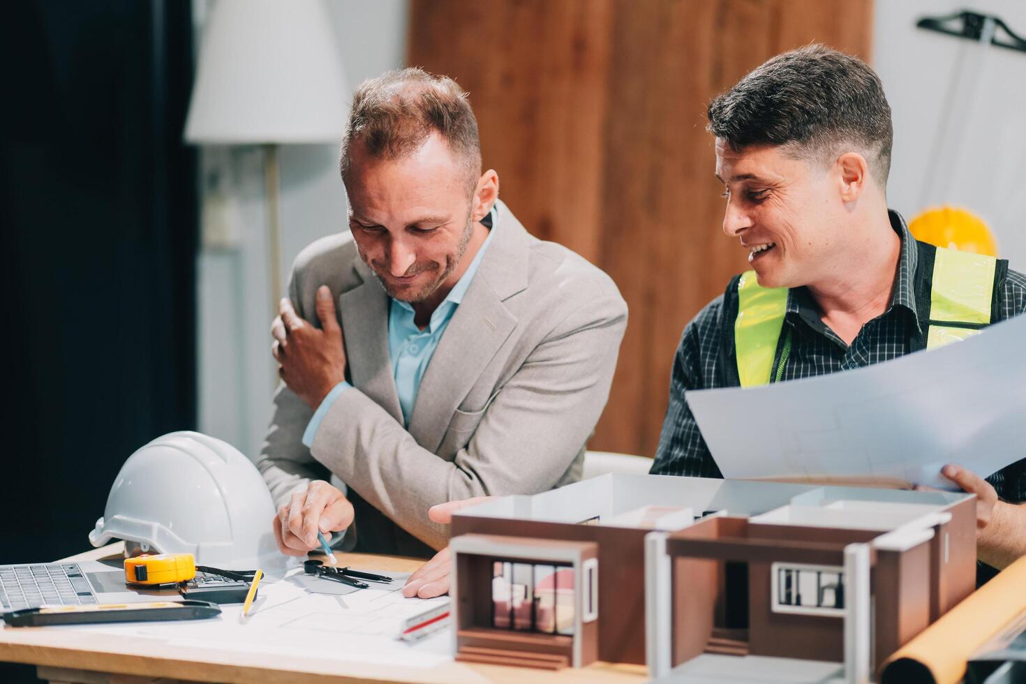 Team Engineers with draft plan of building on constructing site. Engineer work on site. engineer visit and inspection site engineer. Inspector engineer check and working on site. photo