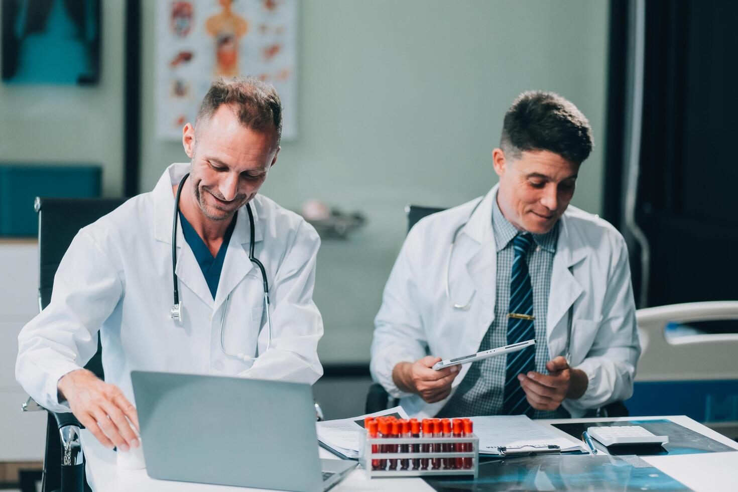 Group of medical practitioners working together and analyzing medical scan in the hospital photo