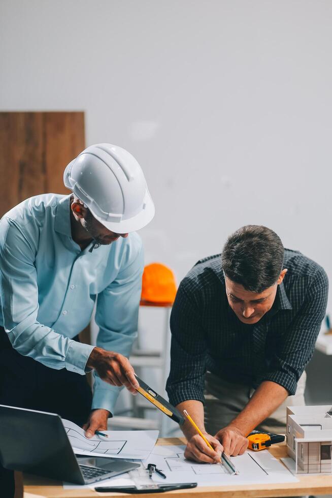Team Engineers with draft plan of building on constructing site. Engineer work on site. engineer visit and inspection site engineer. Inspector engineer check and working on site. photo