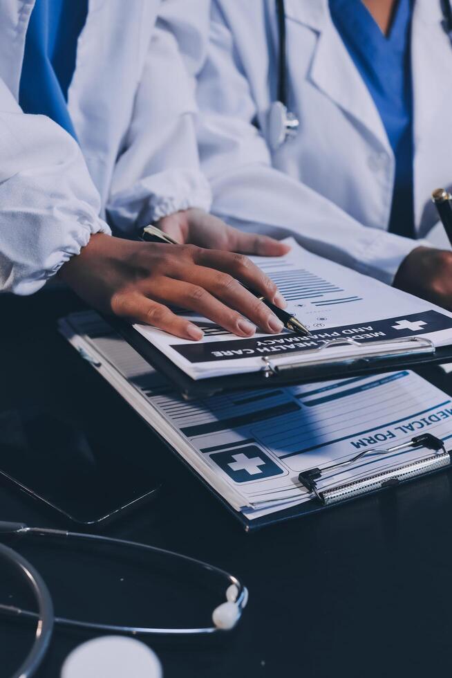 Medical team working on digital tablet healthcare doctor technology tablet using computer analyzed the results of medical reports at the hospital. photo