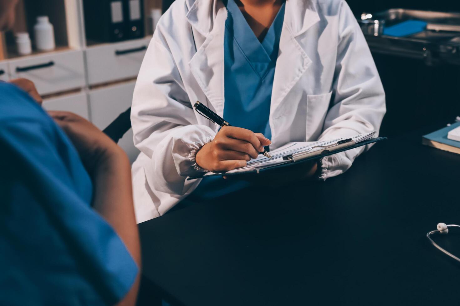 Clinic, tablet and hands of doctor with patient for consulting, medical service and help in hospital. Healthcare, telehealth and people on digital tech for diagnosis, online results and insurance photo