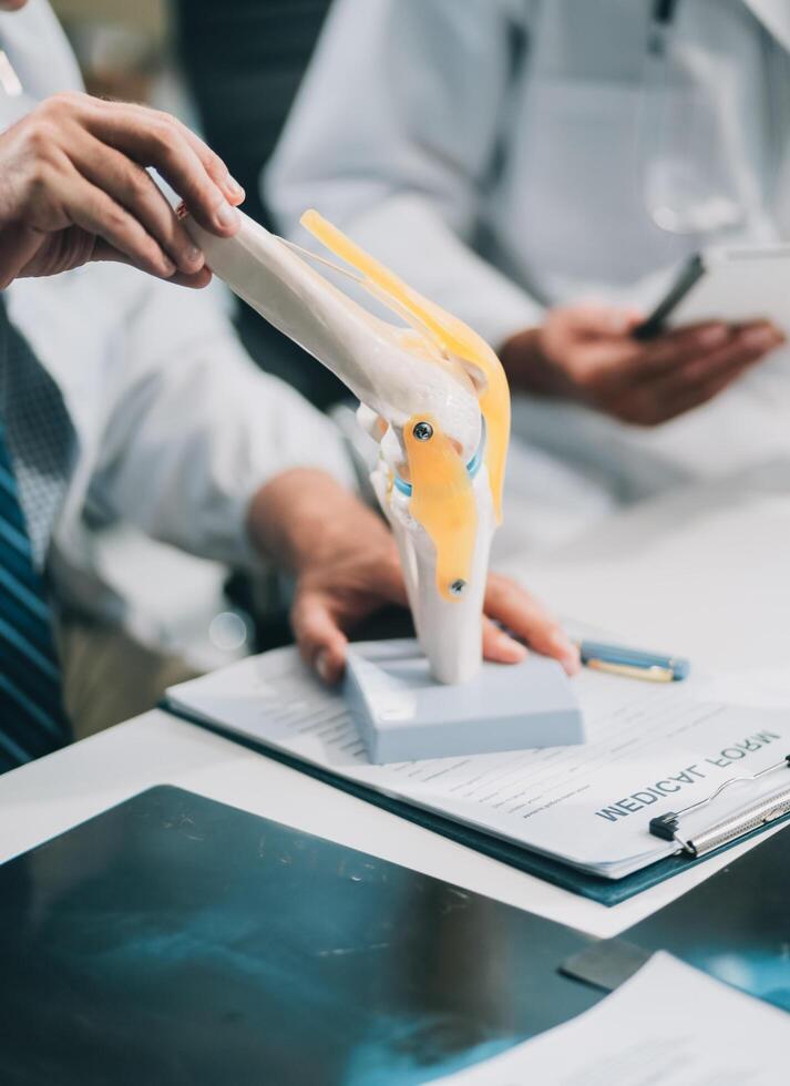 Group of medical practitioners working together and analyzing medical scan in the hospital photo