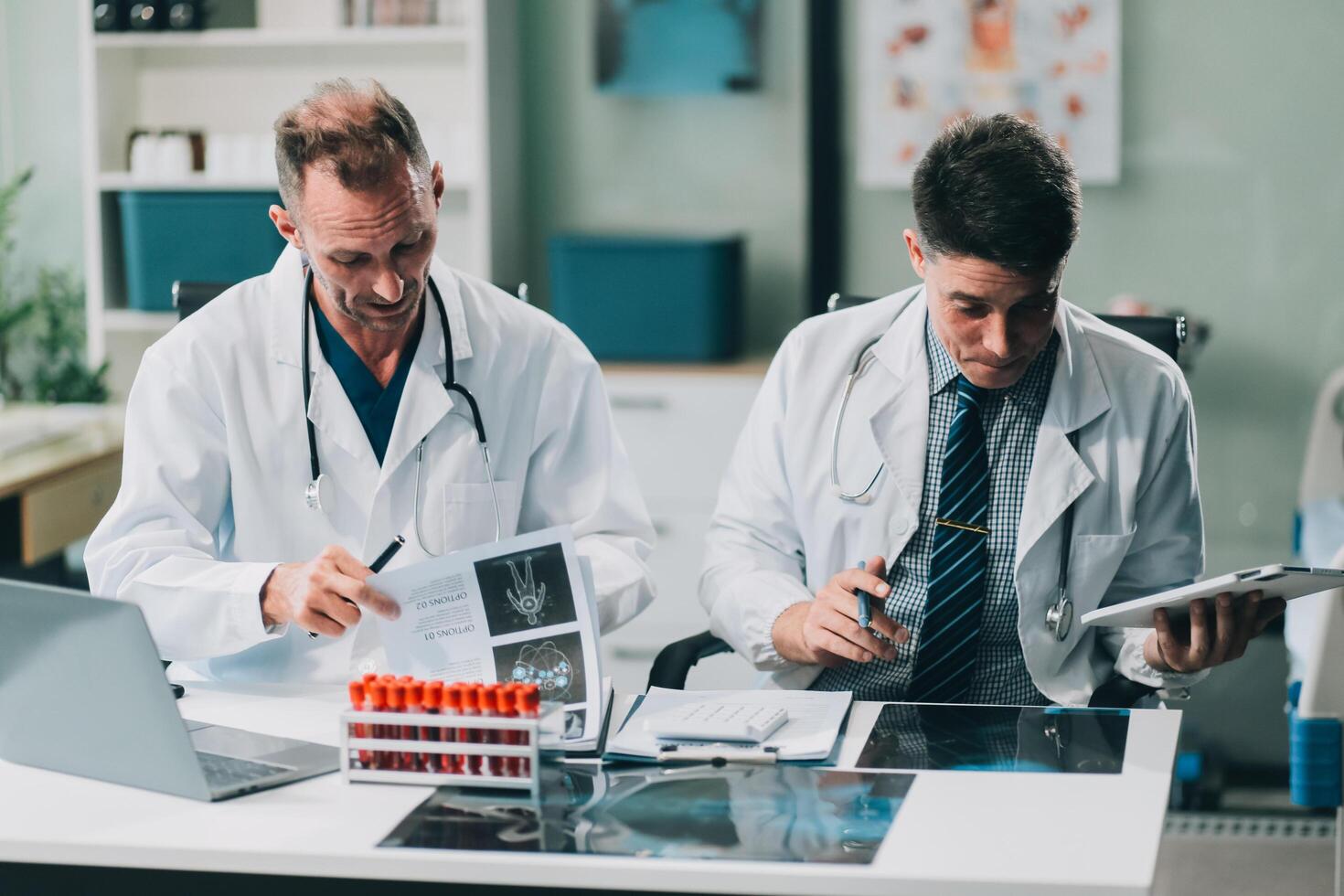 Group of medical practitioners working together and analyzing medical scan in the hospital photo