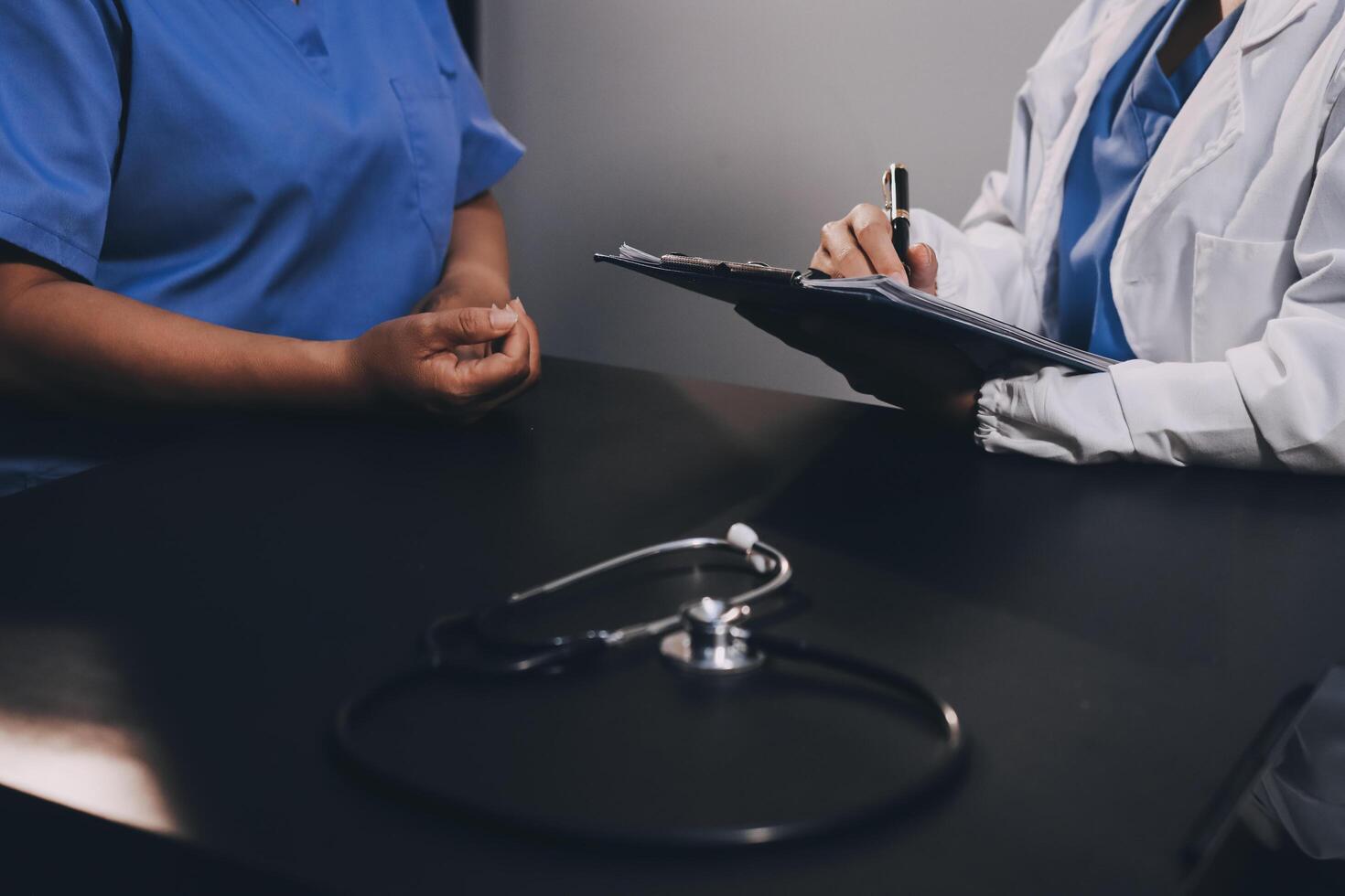 Clinic, tablet and hands of doctor with patient for consulting, medical service and help in hospital. Healthcare, telehealth and people on digital tech for diagnosis, online results and insurance photo