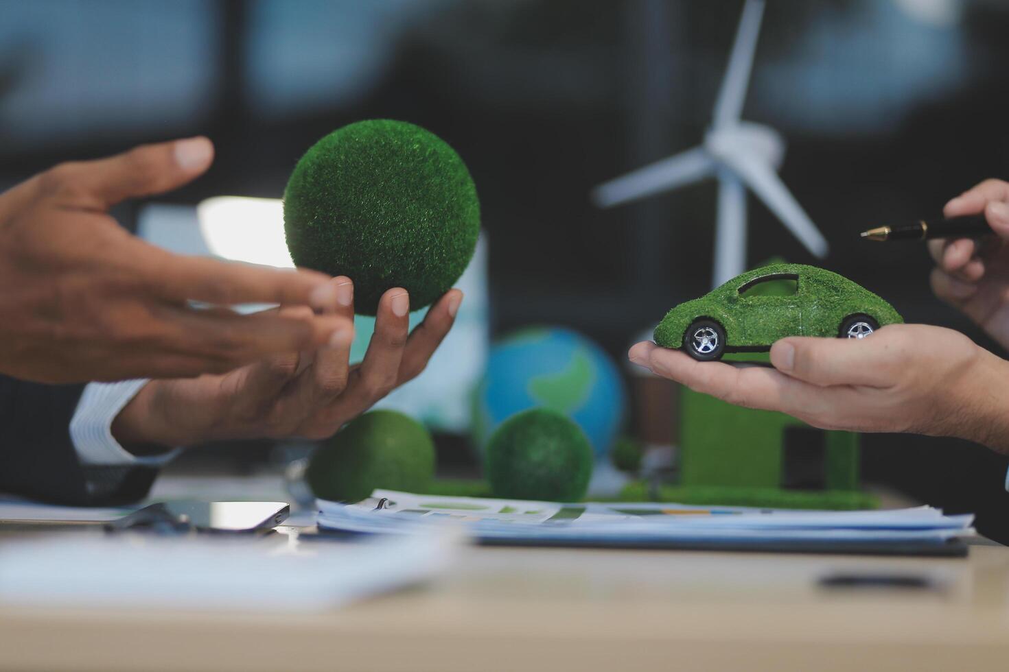 Green energy business company meeting with business people planning and discuss marketing of sustainable and renewable clean energy product with solar cell and wind turbine generator. Trailblazing photo
