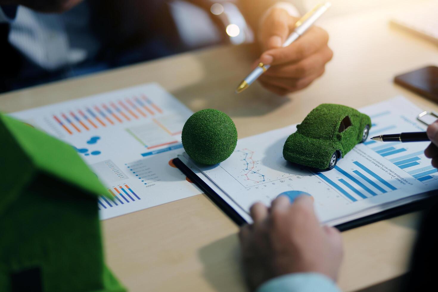 Green energy business company meeting with business people planning and discuss marketing of sustainable and renewable clean energy product with solar cell and wind turbine generator. Trailblazing photo