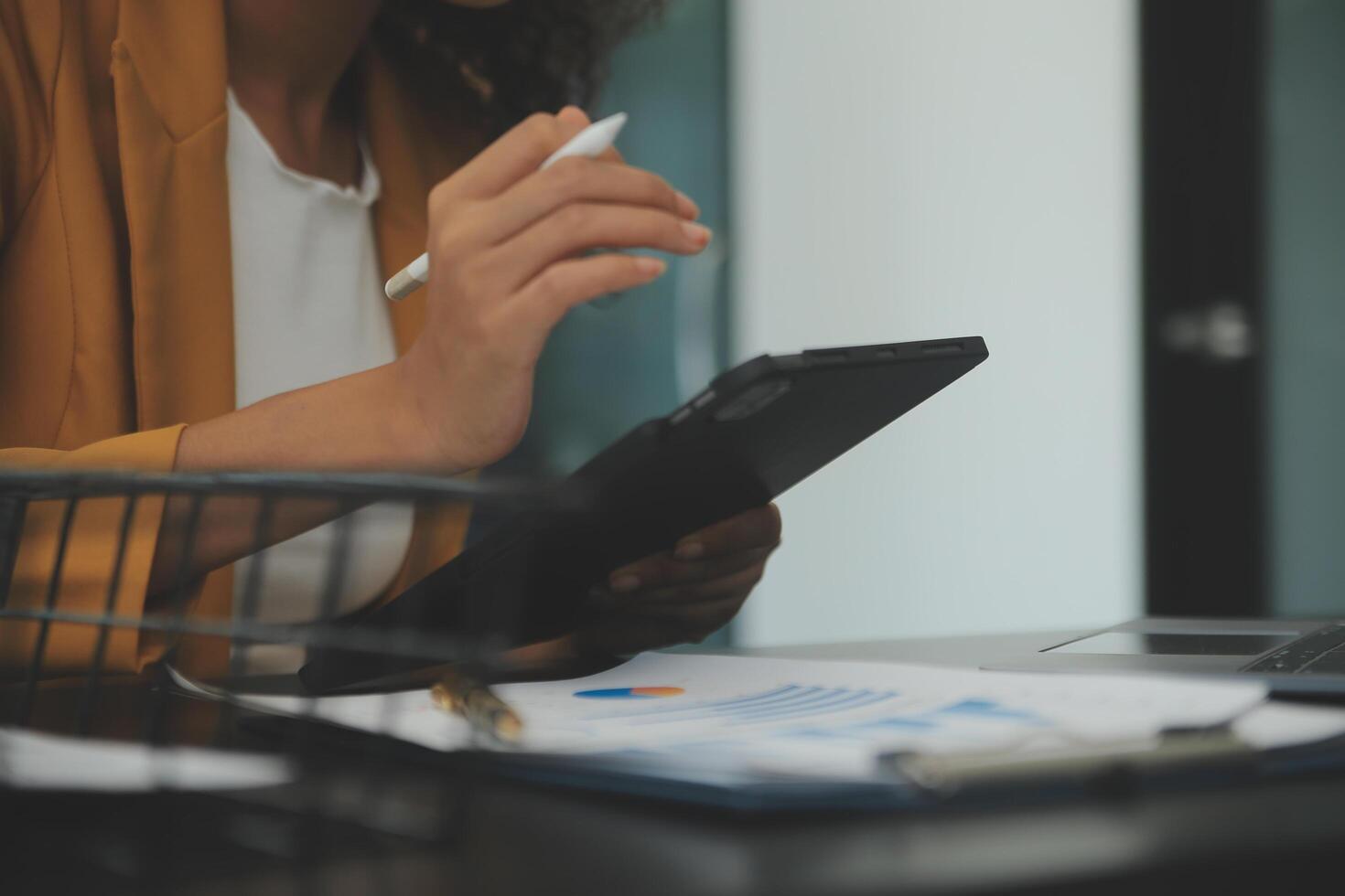 Close up Business woman using calculator and laptop for do math finance on wooden desk, tax, accounting, statistics and analytical research concept photo