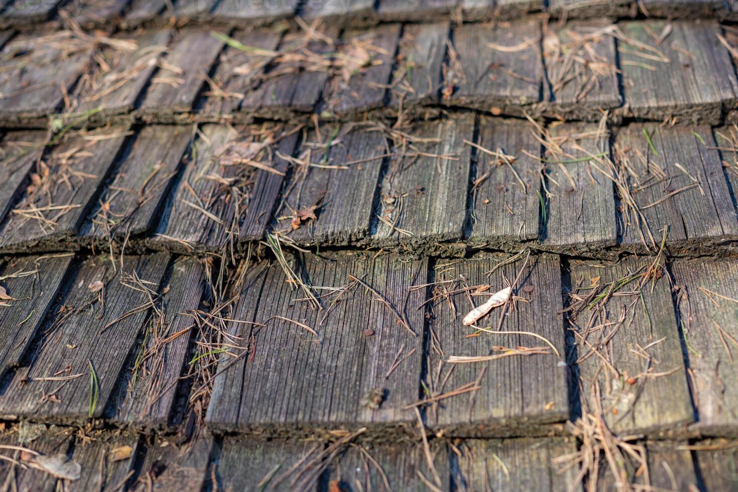 old wooden house, old windows, old building. wooden roof shingle photo