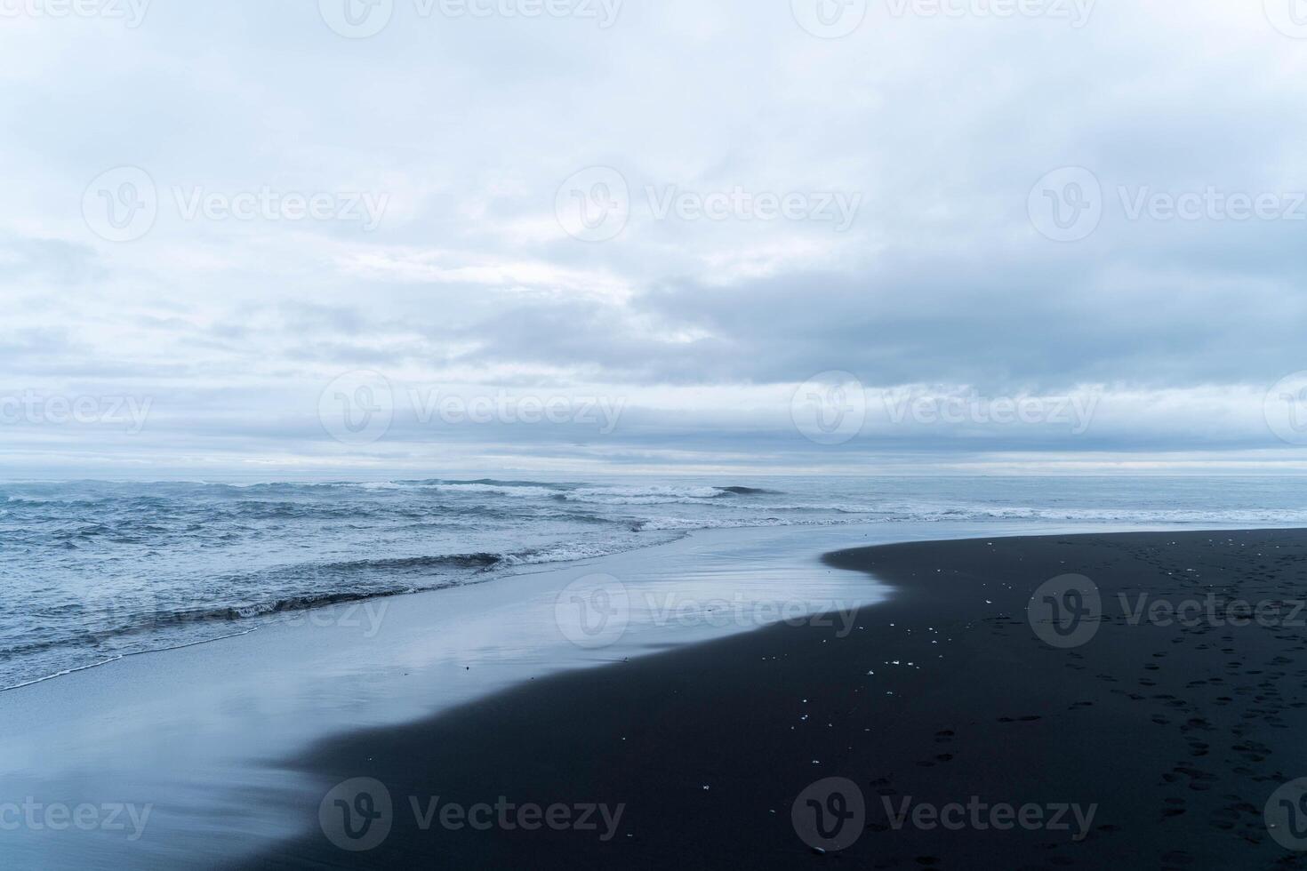 Calm Waves on a Black Sand Beach photo