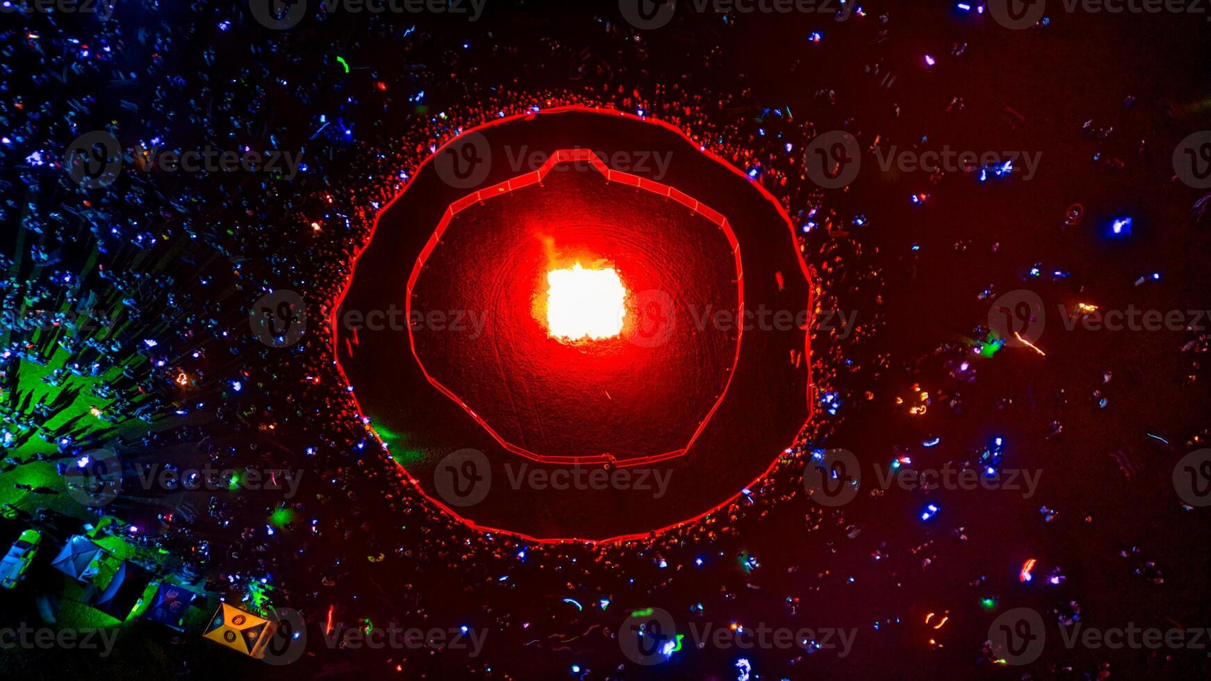 Aerial View of a Crowd Surrounding a Fire Ring photo