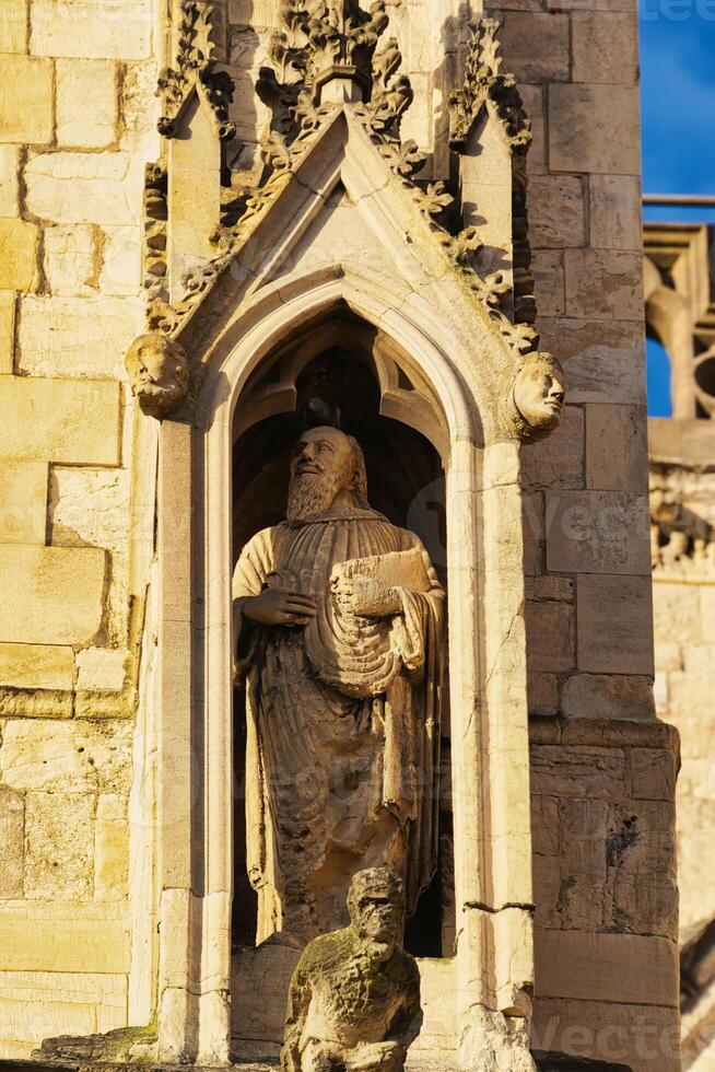 Stone Statue in Niche on Building Facade in York, North Yorkshire, UK. photo