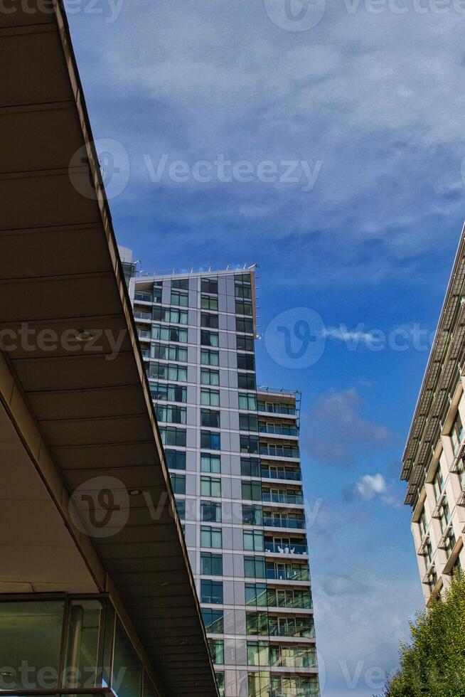 Modern Building Partially Obscured by Angular Structure photo