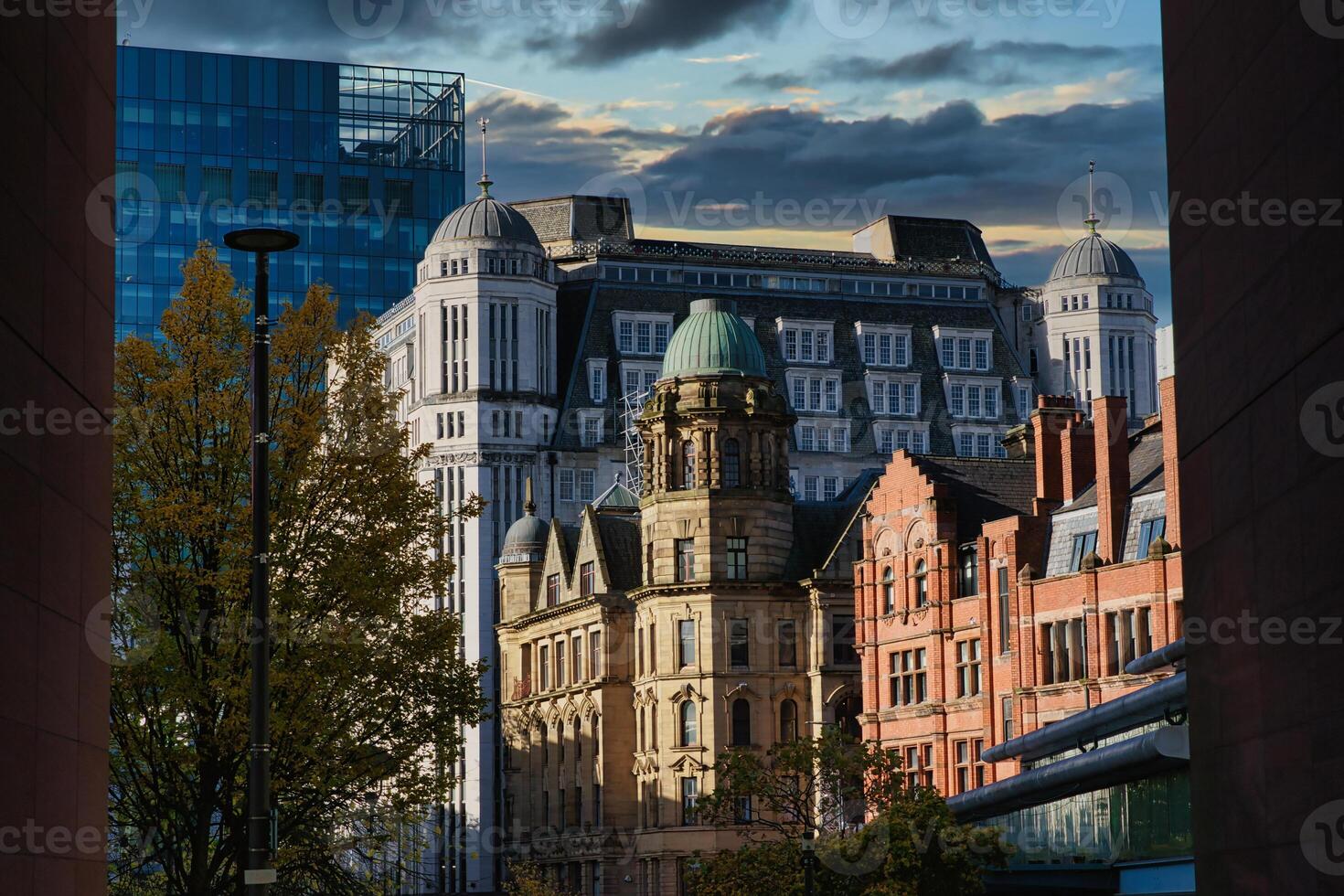 Urban Skyline with Glass, White, and Red-Brick Buildings photo
