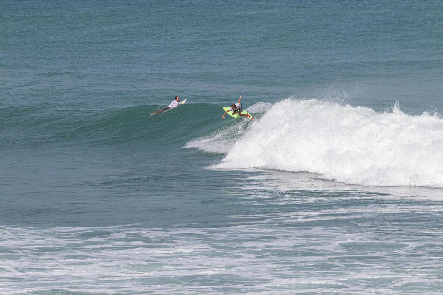 Surfer riding a nice right wave in VVF, tartane, Martinique, West Indies, France photo