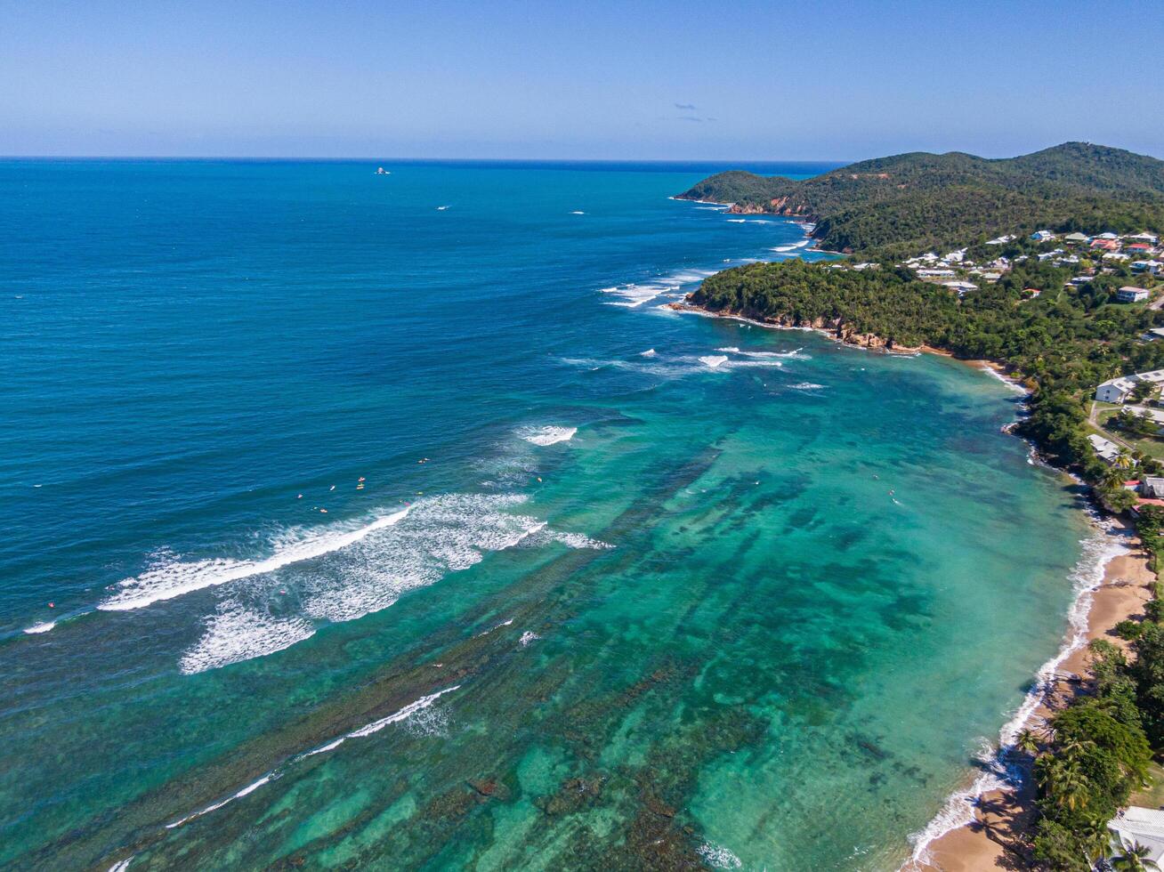 Surfers on Tartane surf spots, Caravelle peninsula, Martinique, West Indies, France photo