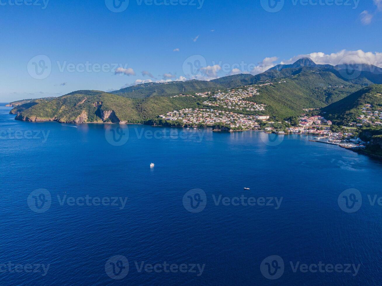 Drone view of the Bay in front of Case-Pilote with diving boats in the ocean, Martinique, West Indies, France photo