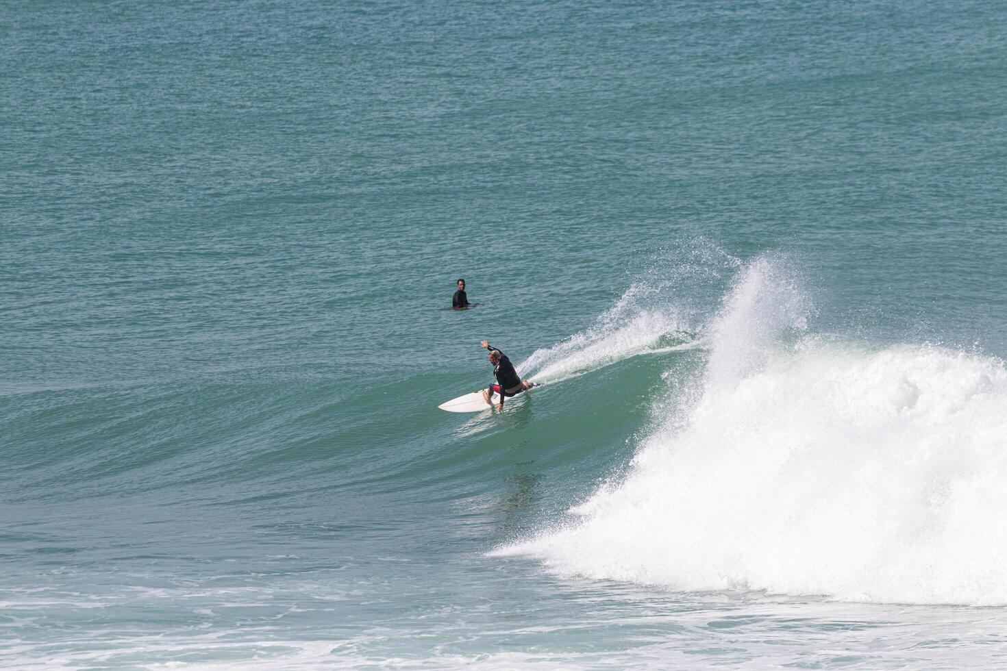 Surfer perfoming a backend turn in VVF, Anse l'etang, tartane, Martinique, West Indies, France photo