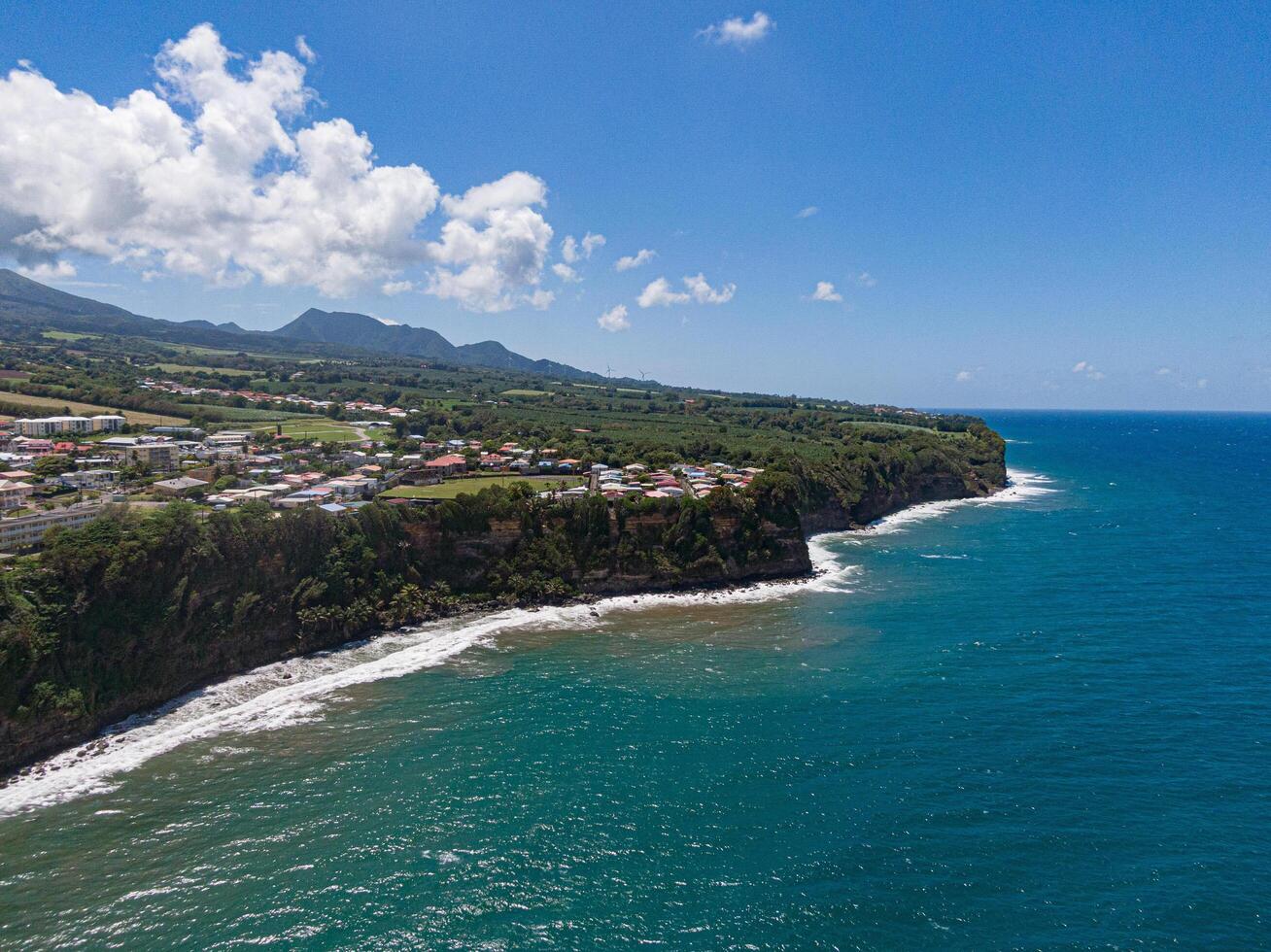 Coastal village on a cliff over the ocean at basse-pointe, Martinique photo