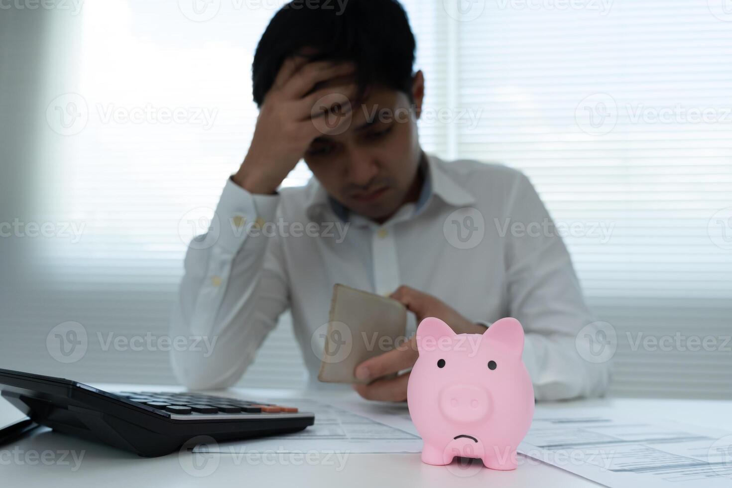 Stressed and headache man no pocket money , No money to pay to expenses and credit card debt. shortage, Financial problems, mortgage, loan, bankruptcy, bankrupt, poor, empty wallet, fall, down, poor photo