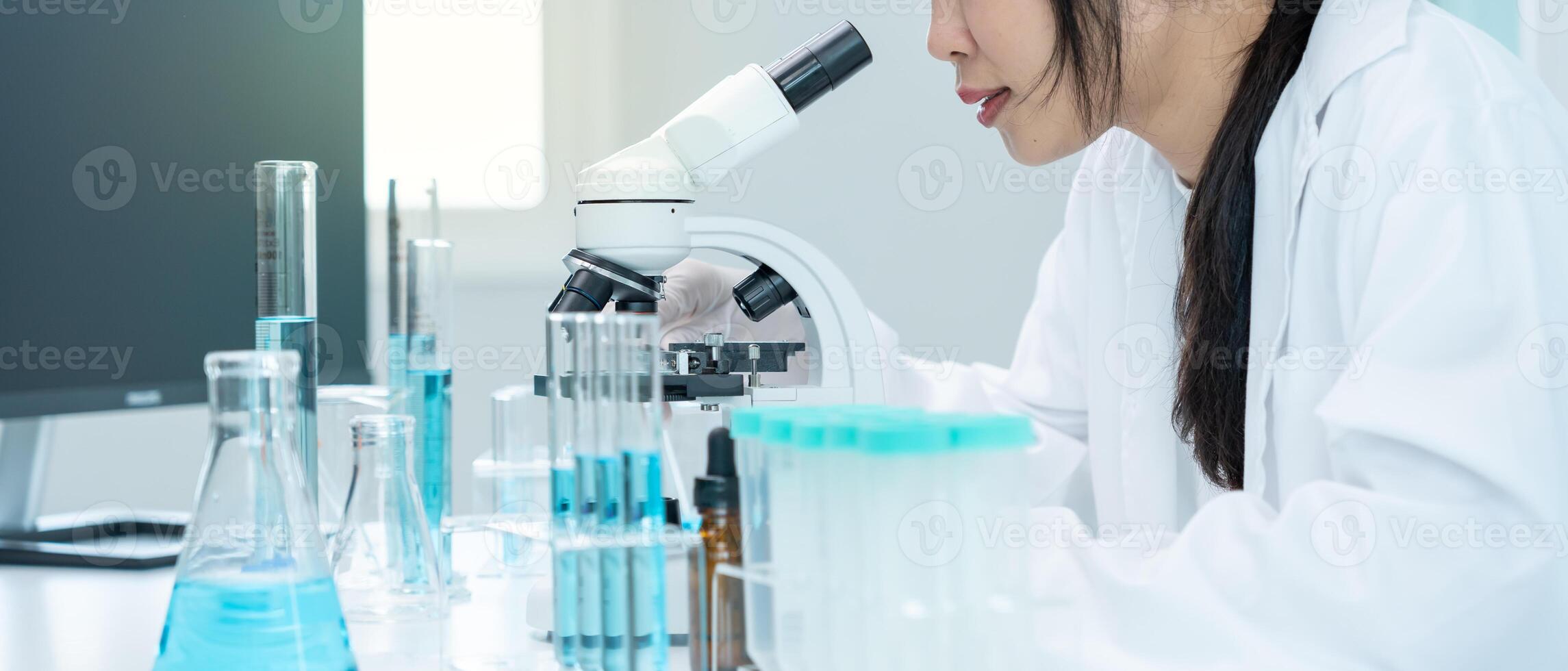 Scientist analyze biochemical samples in advanced scientific laboratory. Medical professional use microscope look microbiological developmental of viral. Biotechnology research in science lab. photo