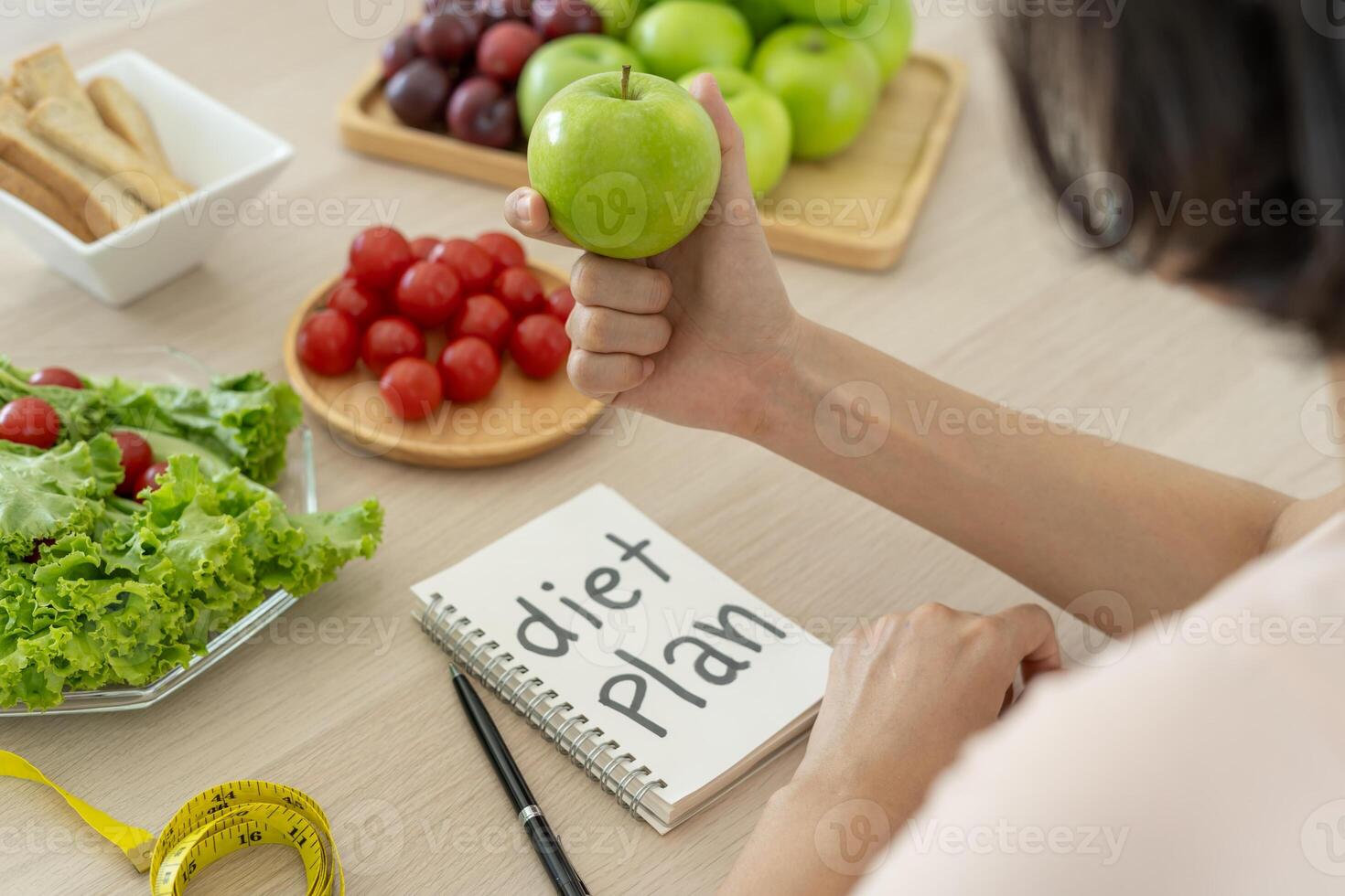 Diet and dieting. Beauty slim female body writing diet plan for healthy food. weight loss, lose, balance, control, reduce fat, low calories, routines, exercise. photo