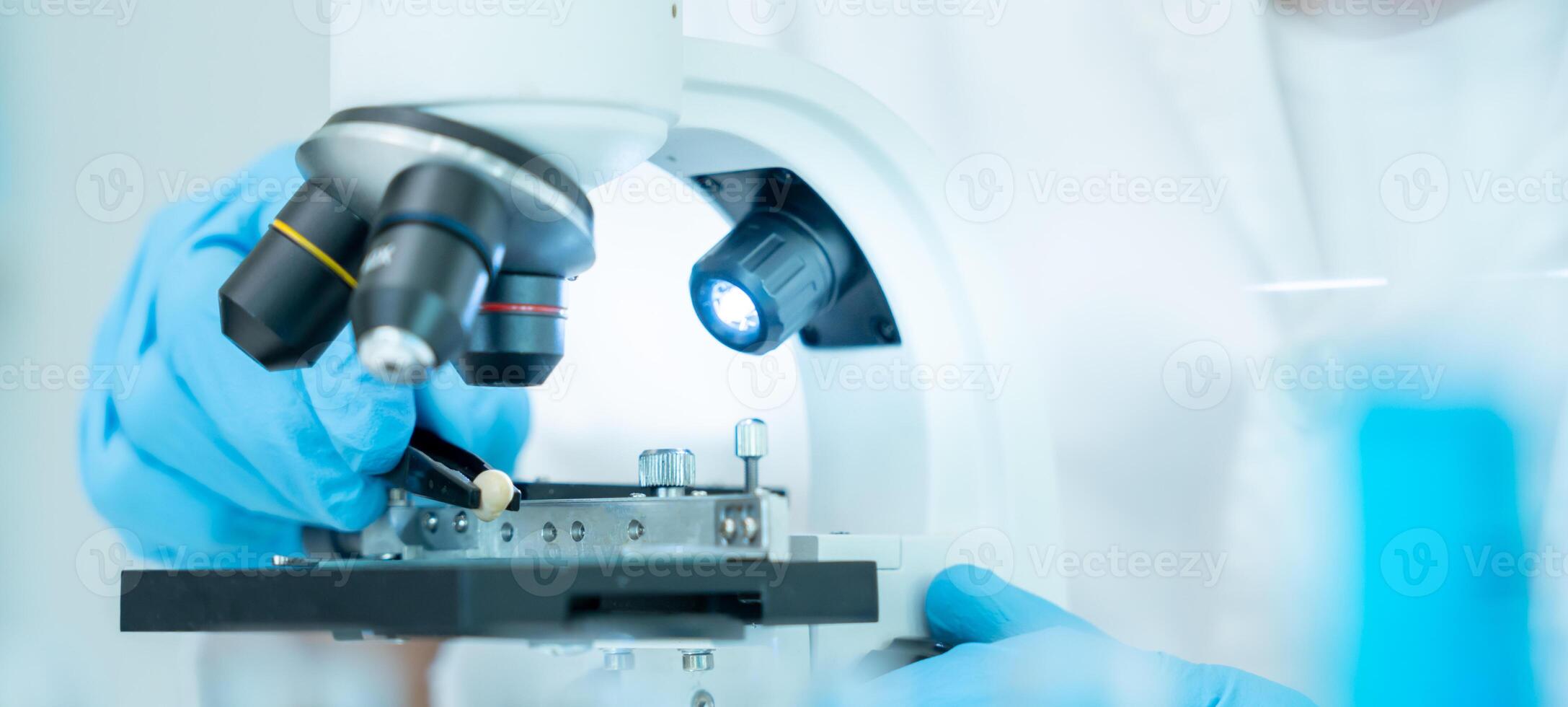 Scientist analyze biochemical samples in advanced scientific laboratory. Medical professional use microscope look microbiological developmental of viral. Biotechnology research in science lab. photo