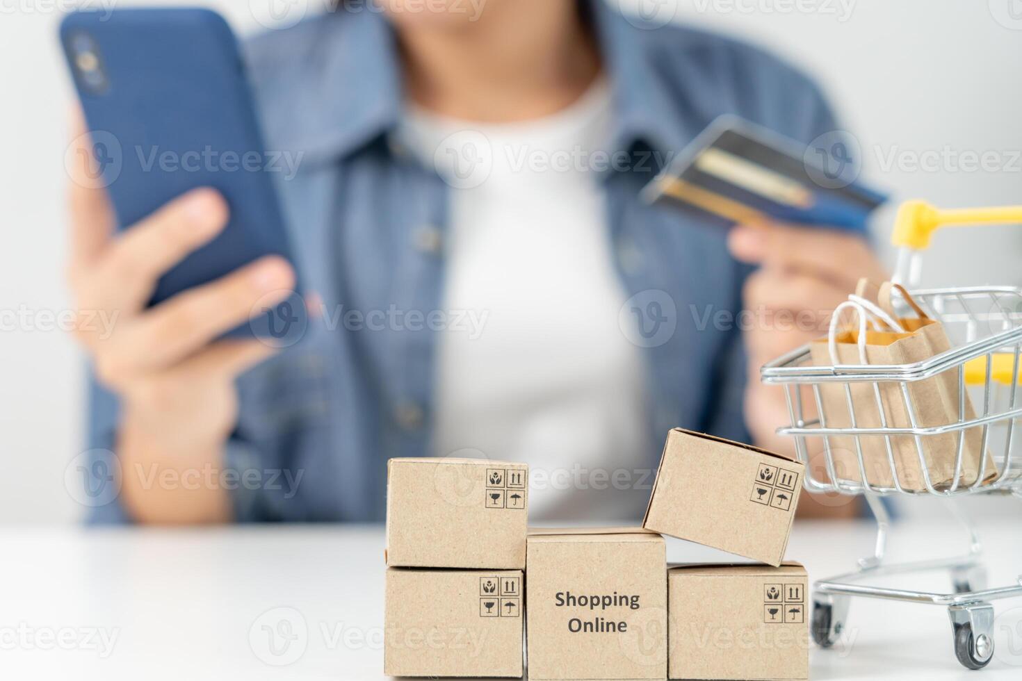 woman using smartphone for online shopping at home. Hand holding mobile phone with payment detail page display and credit card, stay home, technology, electronic commerce, internet, market place photo