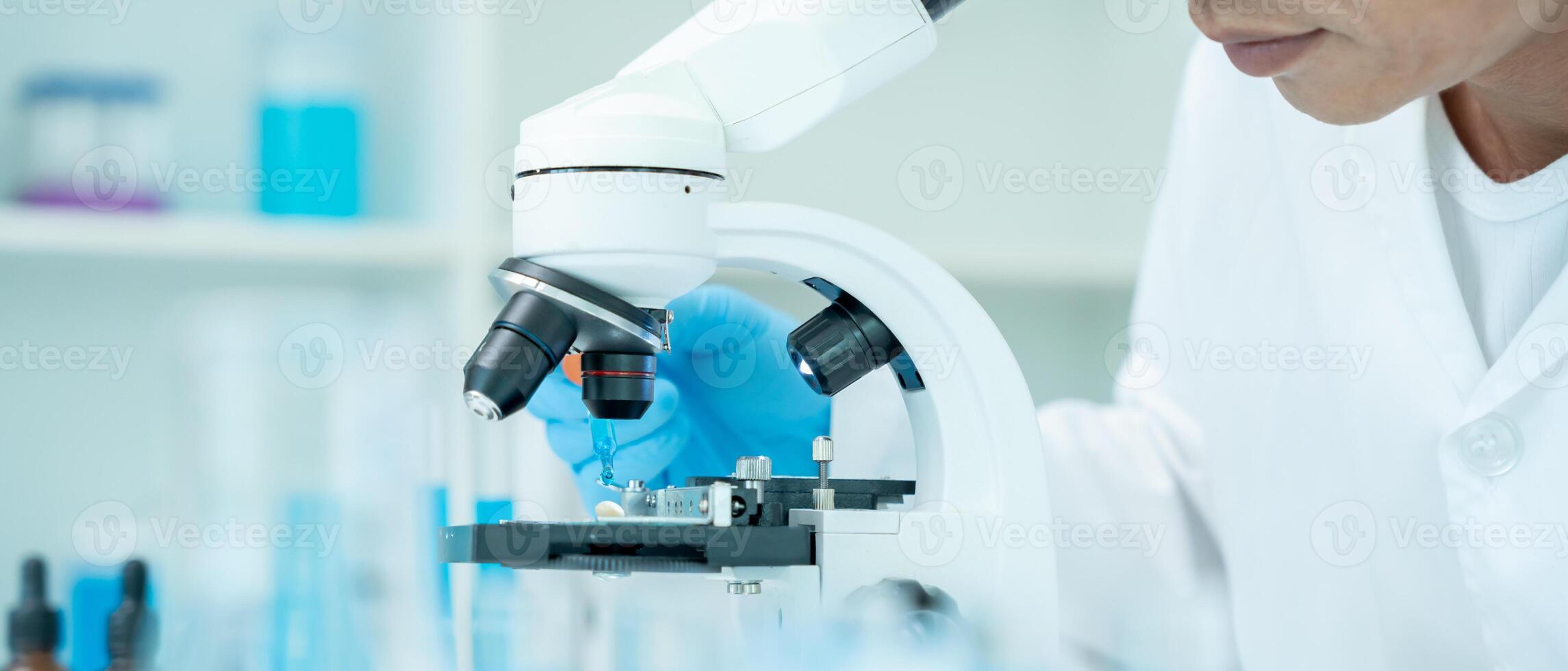 Scientist analyze biochemical samples in advanced scientific laboratory. Medical professional use microscope look microbiological developmental of viral. Biotechnology research in science lab. photo