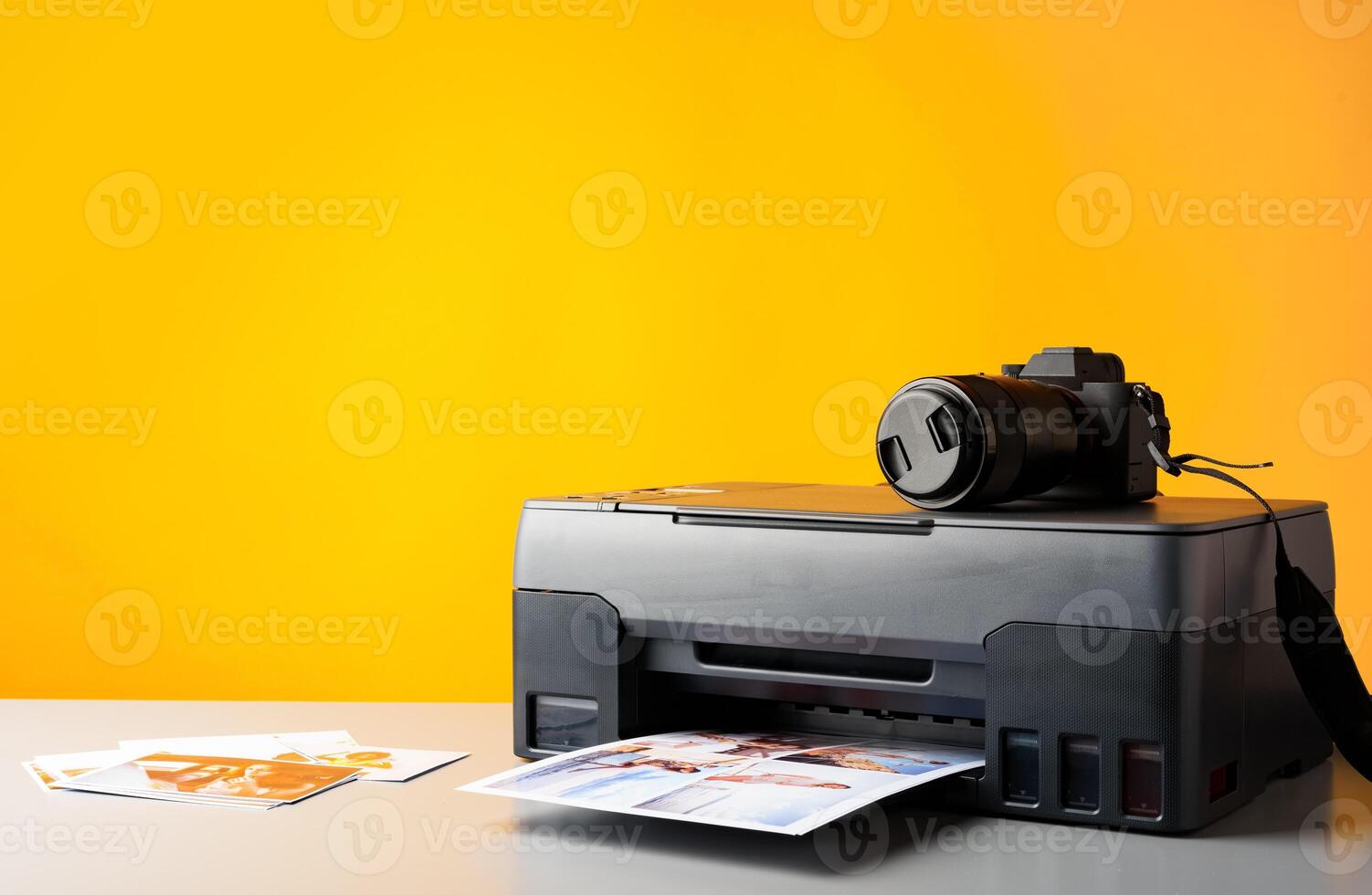 Printer and photo camera on table. Printing photos concept