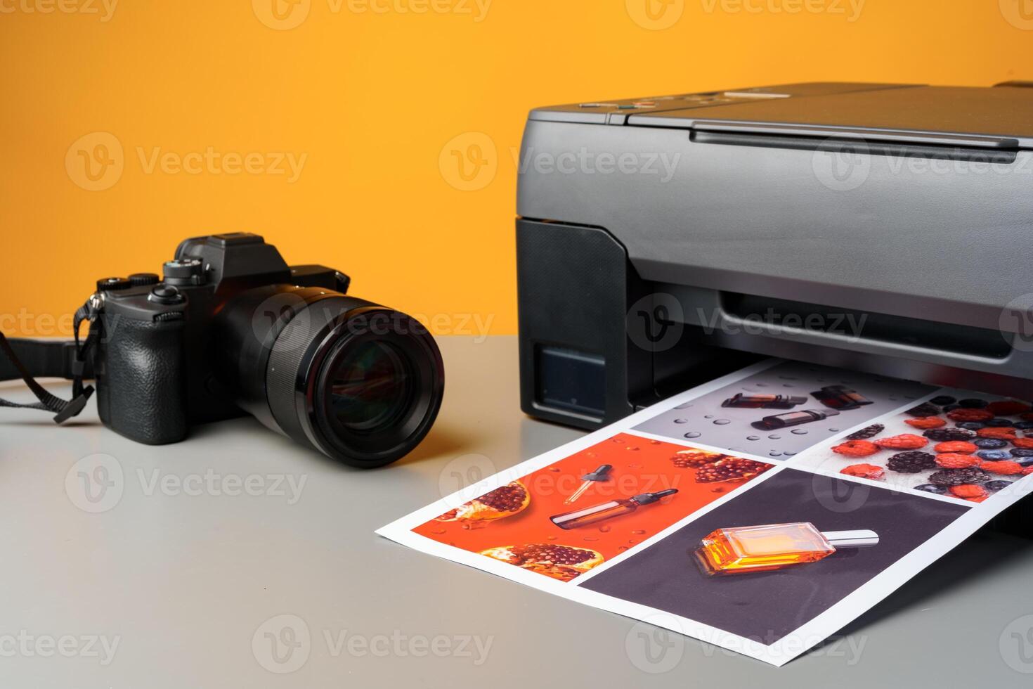 Printer and photo camera on table. Printing photos concept