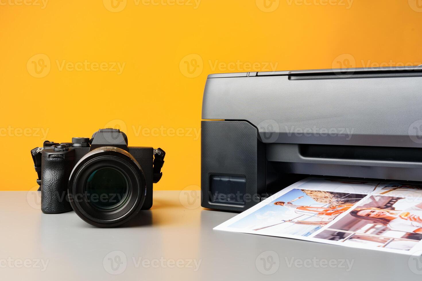Printer printing colorful photos of people close up, yellow background