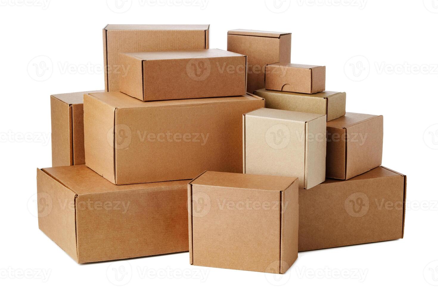Stacked brown cardboard boxes in various sizes arranged on a white background photo