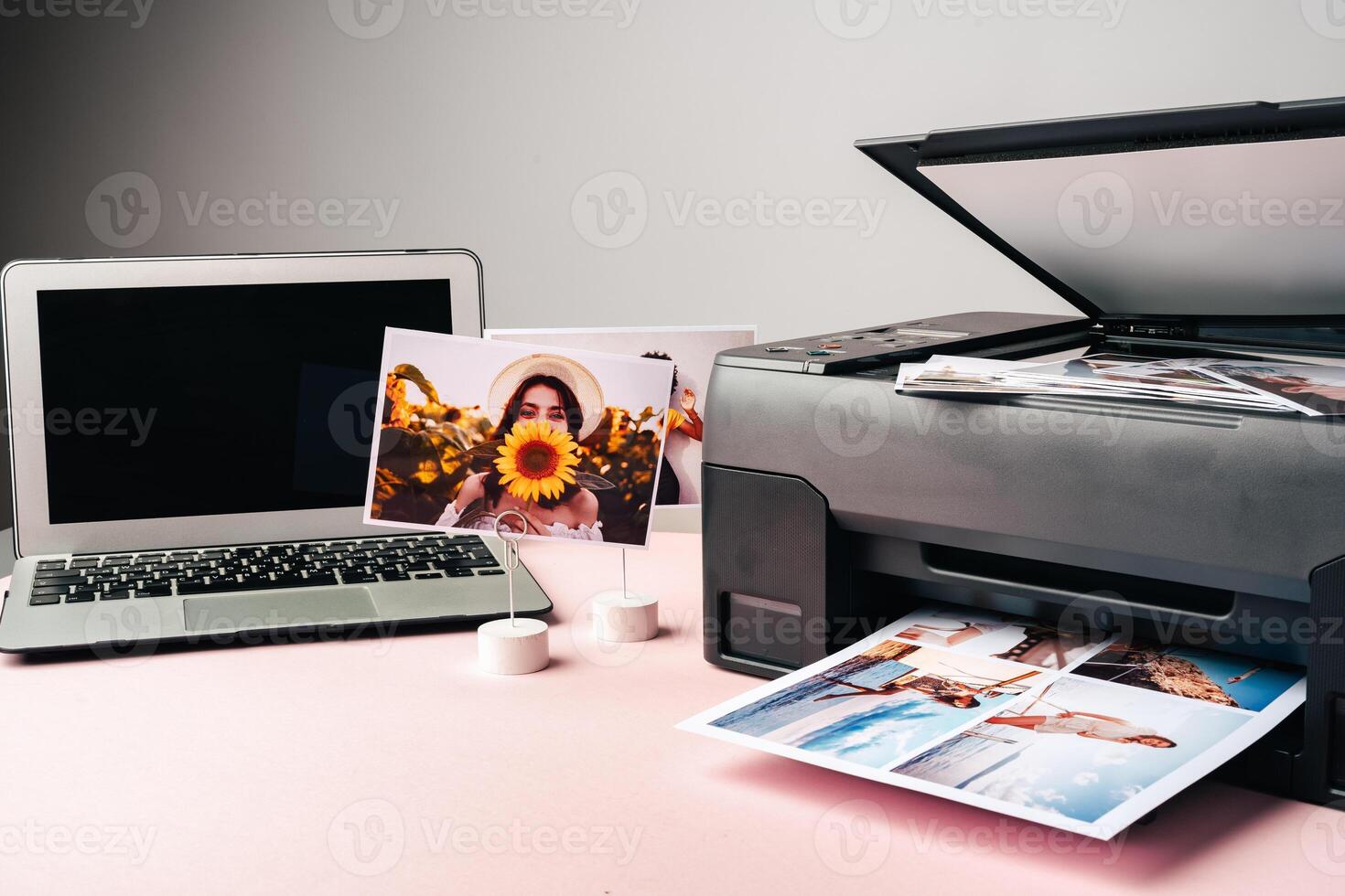 Computer laptop and printer on table. Printing photos