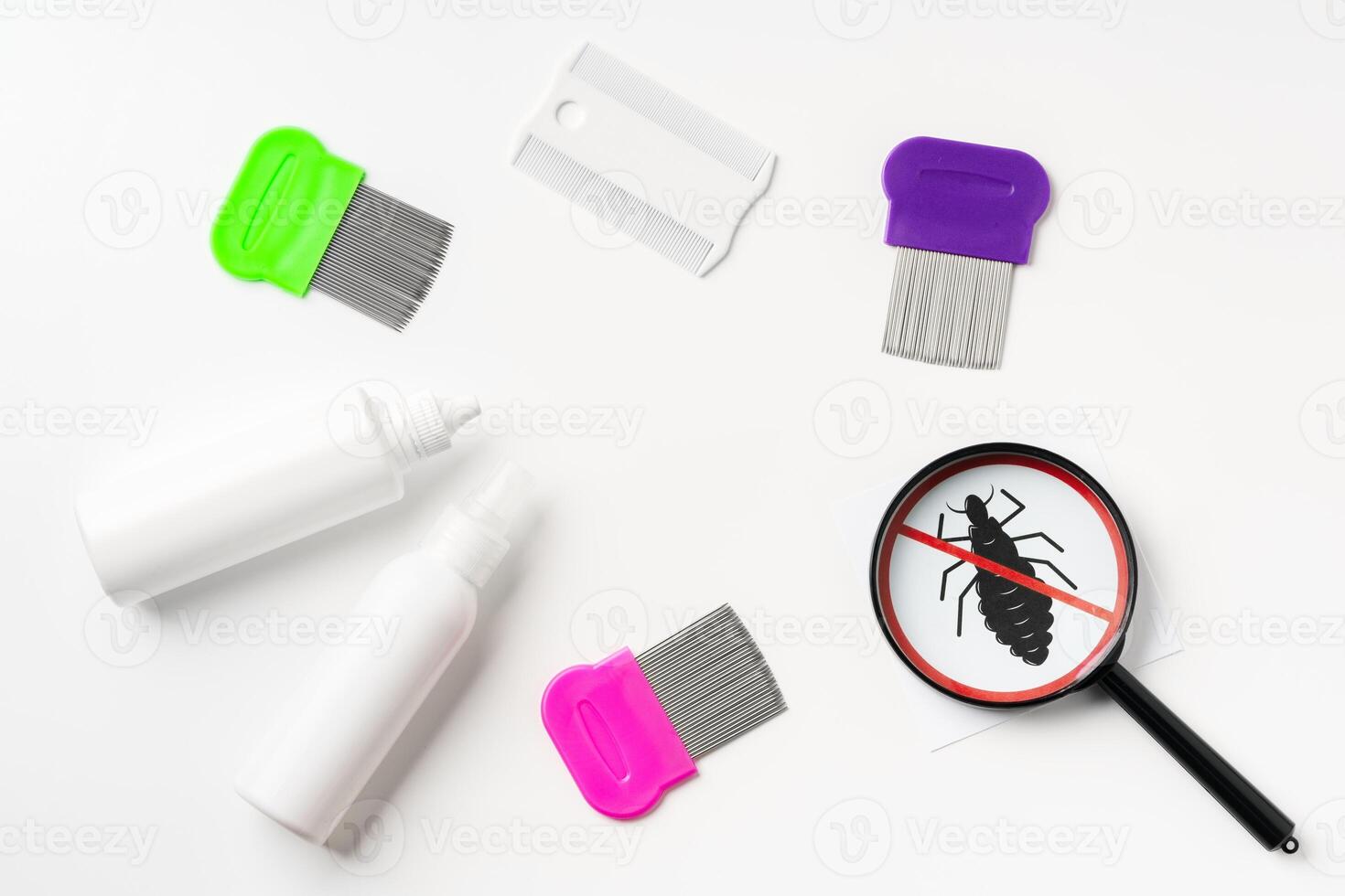 Tools for inspecting and treating lice infestations at home with a magnifying glass and a comb photo