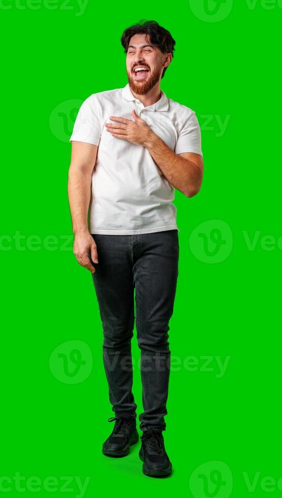 Young man expresses surprise in front of a bright green background photo