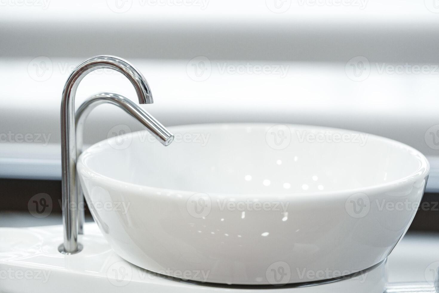 Modern dental workstation featuring an elegant bowl sink and sleek tap design in a well-lit clinic photo