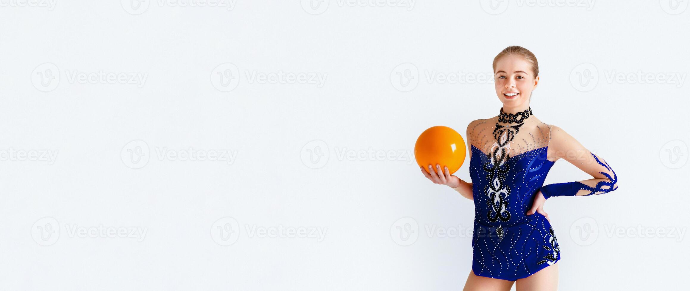 Portrait of smiling gymnast girl with ball, isolated on white background photo