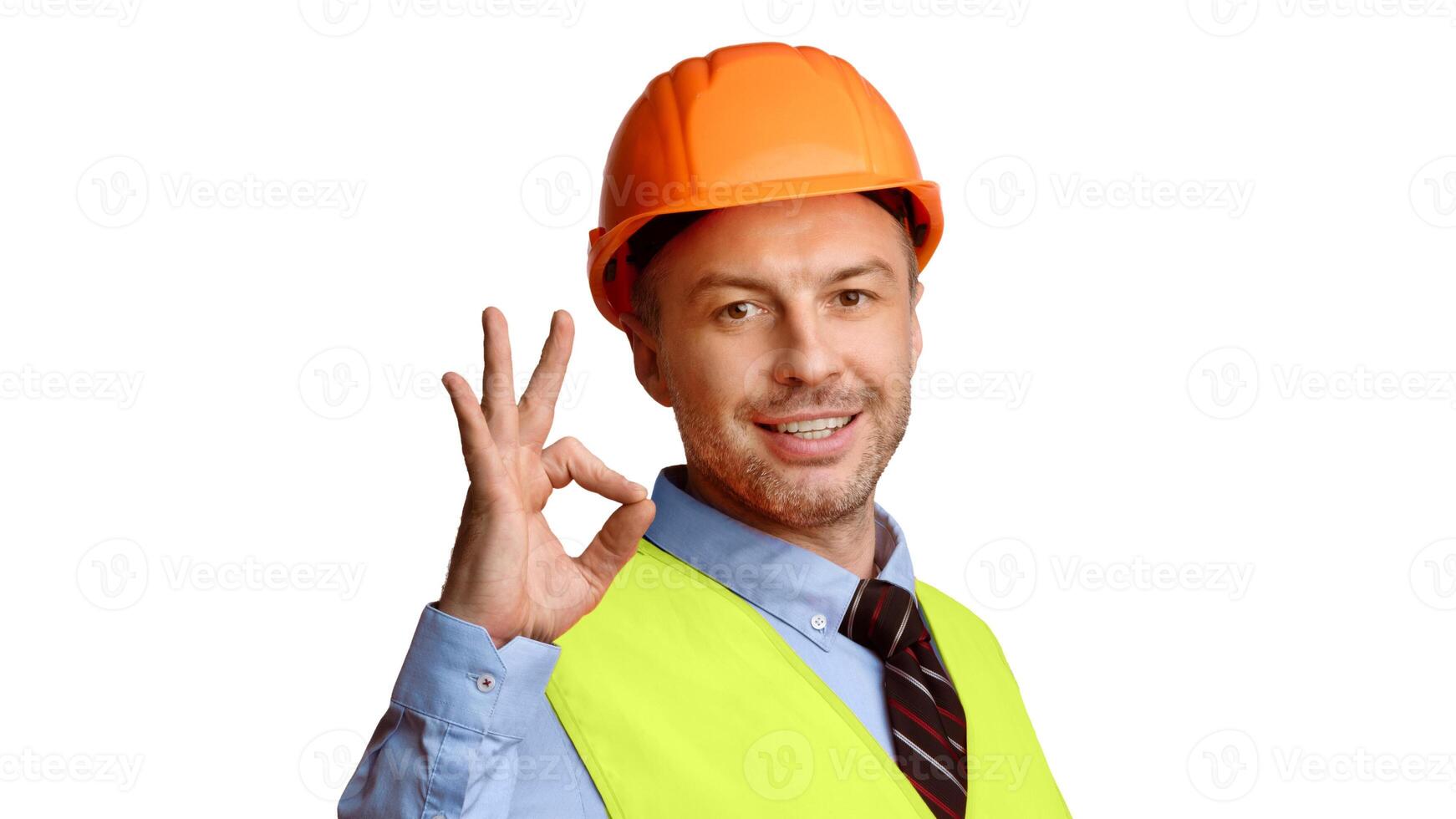 Cheerful Builder In Uniform Gesturing Ok Sign Smiling To Camera Standing On White Studio Background. Construction Worker Approving, Building Is Okay, Advertisement Banner Concept. Panorama photo