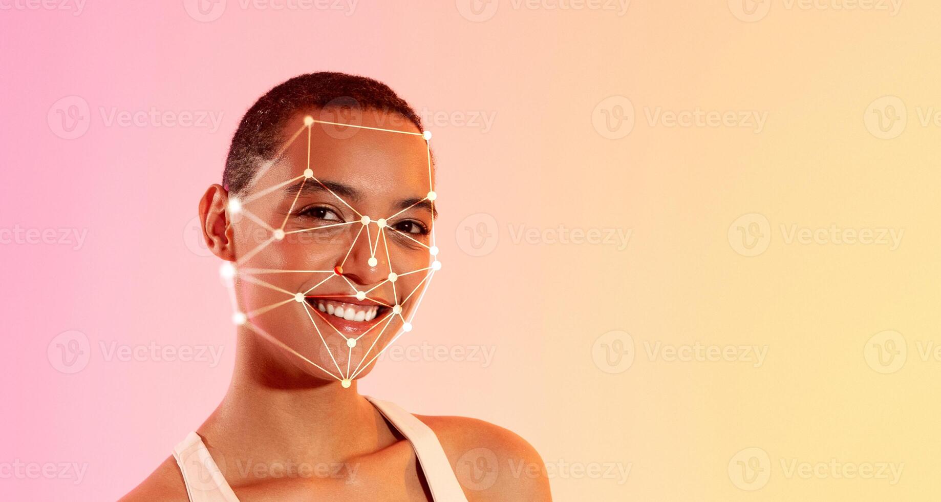 African American woman with short hair smiles confidently as a facial recognition grid overlays her features, set against a vibrant gradient background that transitions from orange to pink. photo