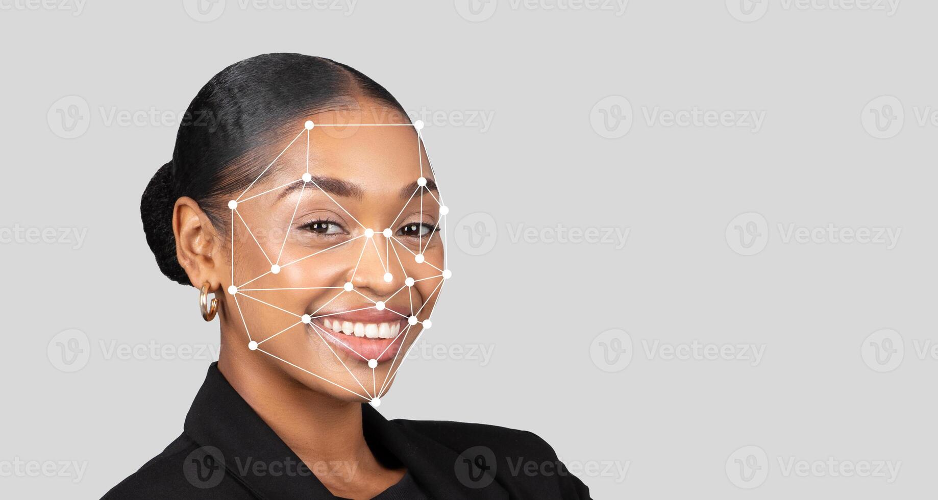A young African American woman with a confident smile showcases the application of facial recognition technology. Her expression reflects positivity and professionalism, highlighting innovation. photo