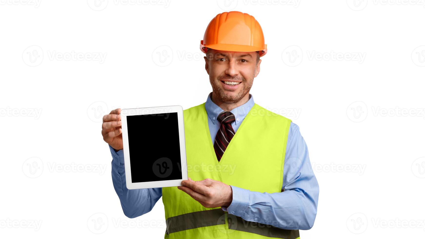 Construction Worker Showing Tablet Computer With Empty Screen Advertising Building Industry Services Standing Over White Studio Background. Building Technologies Concept. Mockup, Panorama photo