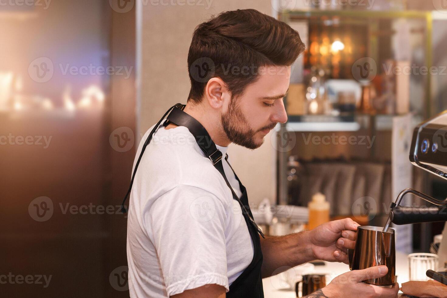 Coffee-Shop Concept. Professional Barista Making Coffee Using Coffee-Machine Standing In Cafe. Small Business And Occupation photo