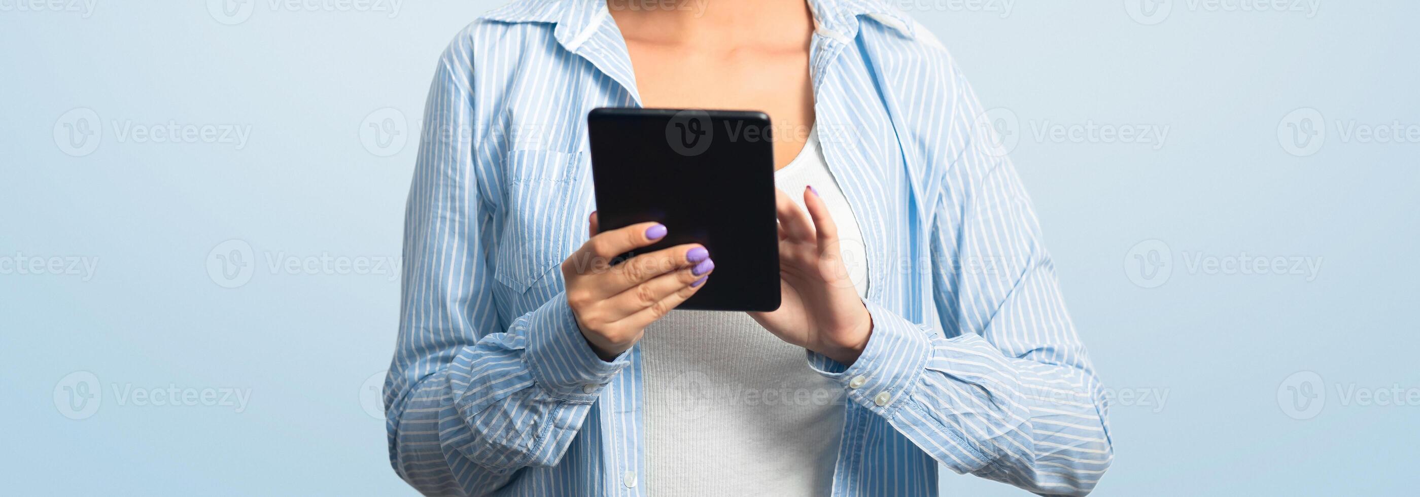 Woman In Face Mask Using Tablet Computer Browsing Internet Reading Coronavirus News Standing On White Studio Background photo