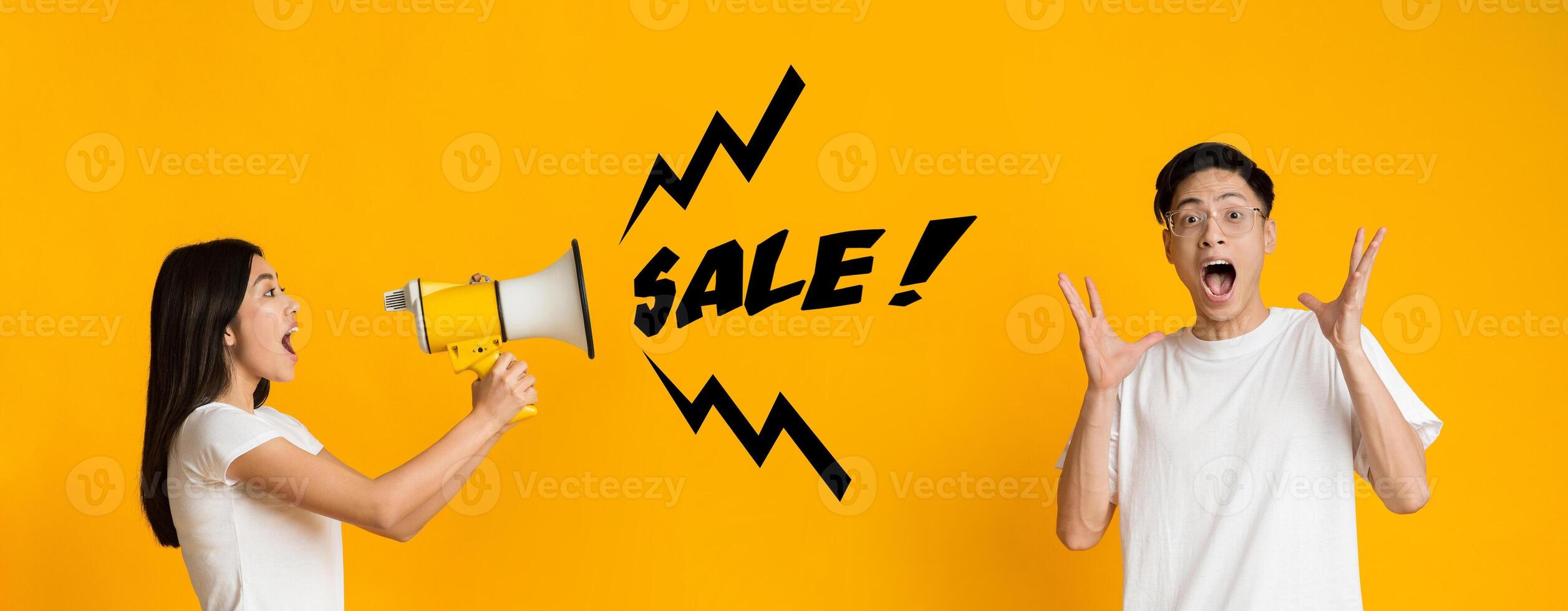 Asian girl shouting exciting news about sale to shocked boyfriend using megaphone, yellow background, panorama photo