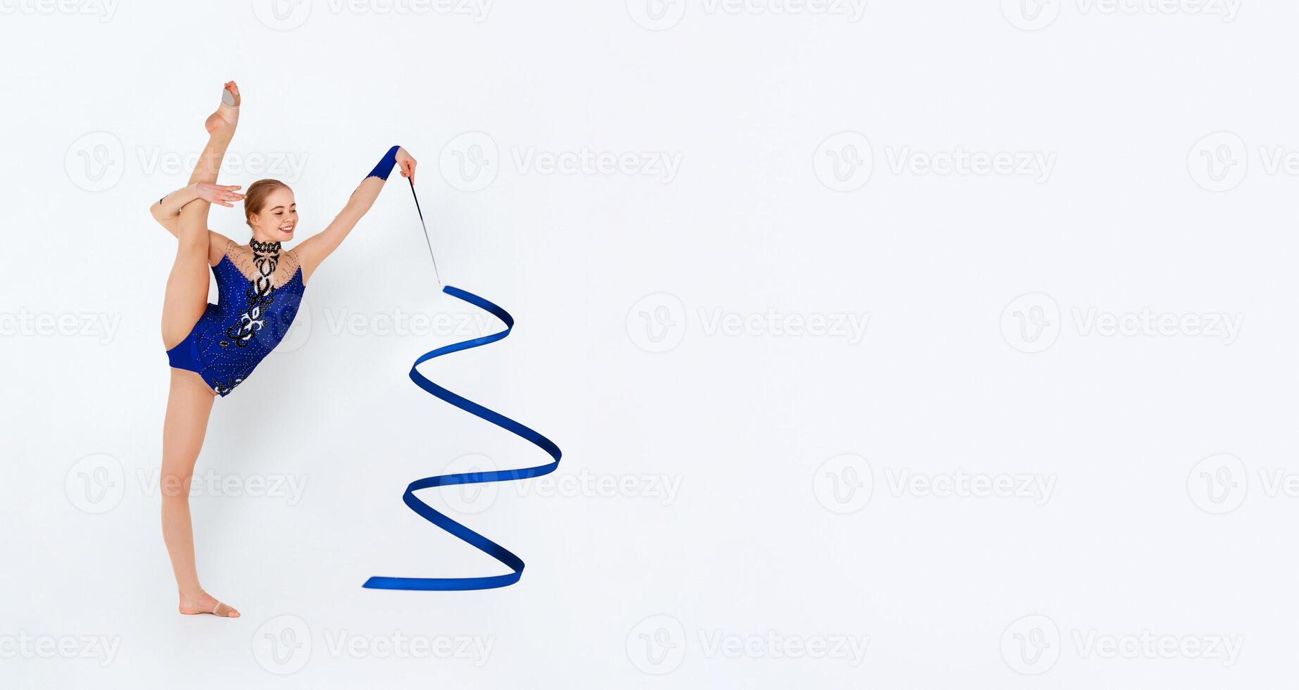 Gymnastics athlete performing beautiful dance with ribbon on white background photo