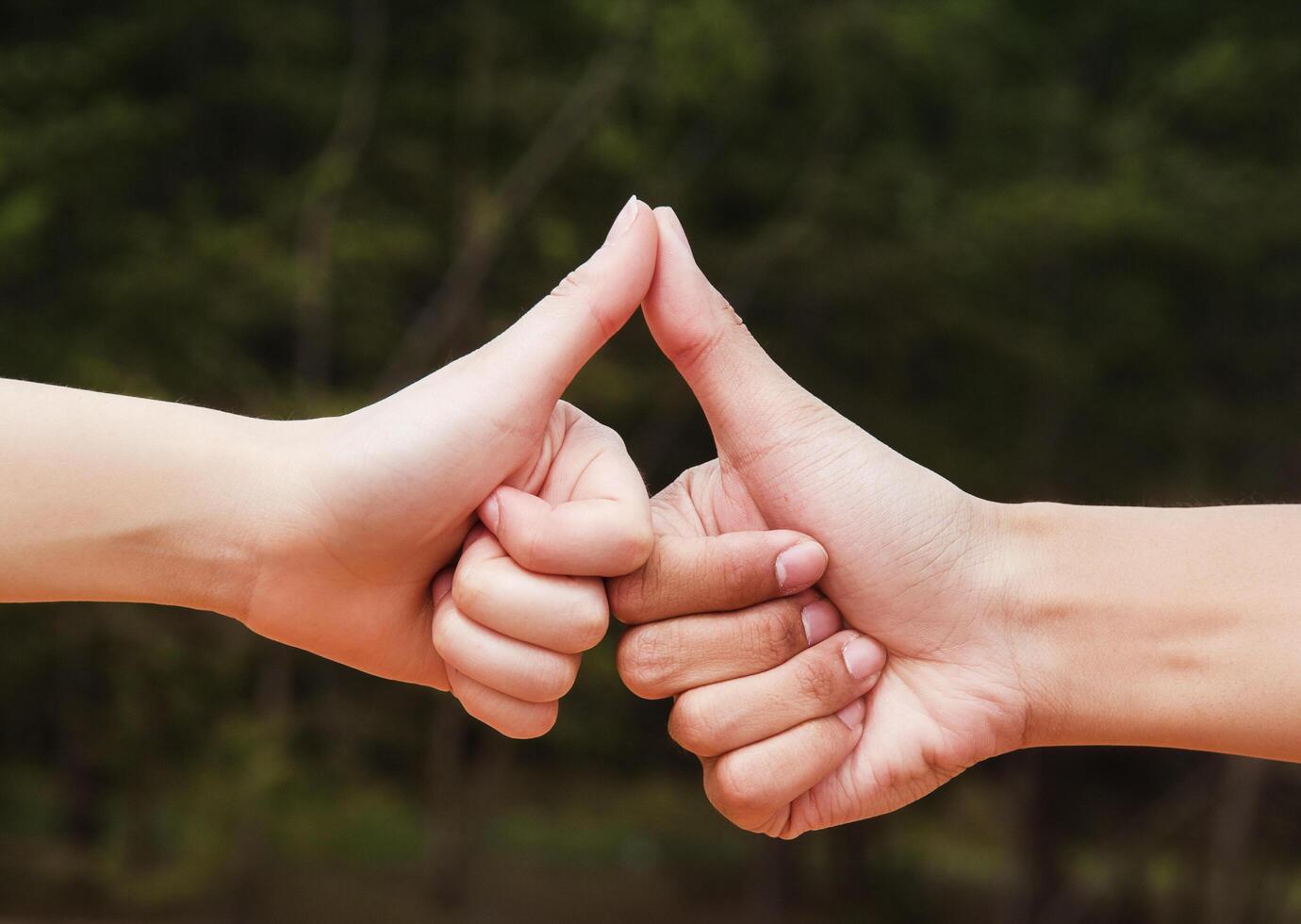thumb touch together.hand sign photo